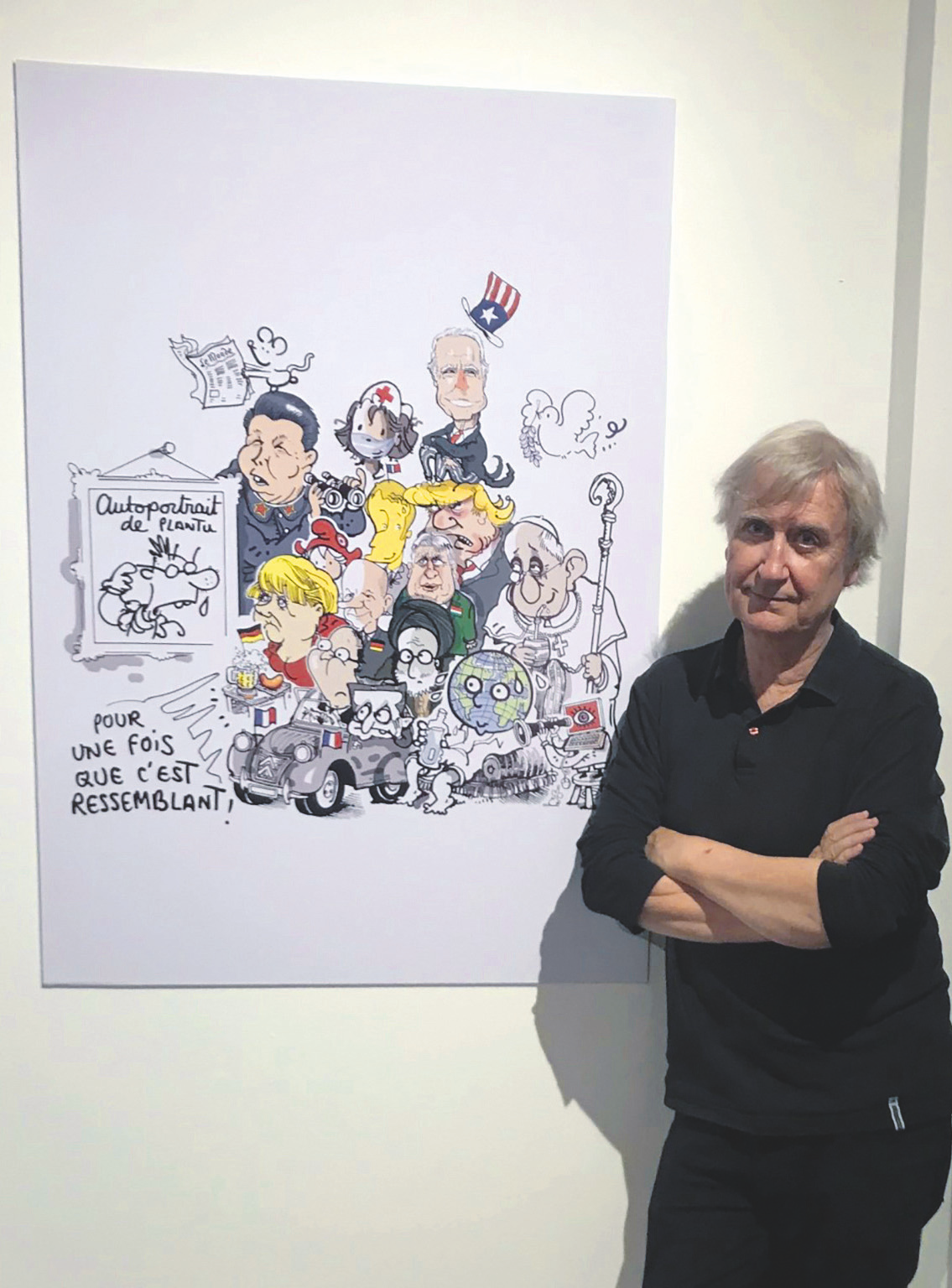 Le caricaturiste français devant l’un de ses dessins de presse.DR